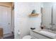 Bathroom features a toilet, a sink with a vanity, and decorative wall paper at 3128 Mountain Hill Dr, Wake Forest, NC 27587