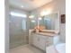 Modern bathroom features a glass shower, stylish mirror, and bathtub at 3128 Mountain Hill Dr, Wake Forest, NC 27587