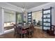 Dining room features a wooden table, chairs, chandelier and sliding glass doors to a porch at 3128 Mountain Hill Dr, Wake Forest, NC 27587
