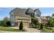 Beautiful home with a two car garage, stone accents, landscaped front yard, and a wide driveway at 3128 Mountain Hill Dr, Wake Forest, NC 27587