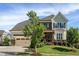 Charming home featuring a landscaped yard, stone accents, and a welcoming front porch with a two-car garage at 3128 Mountain Hill Dr, Wake Forest, NC 27587