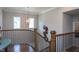 Open hallway with wood flooring, stairway, and decorative lighting at 3128 Mountain Hill Dr, Wake Forest, NC 27587