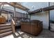 This outdoor patio has a covered hot tub, pergola, and lounge area at 3128 Mountain Hill Dr, Wake Forest, NC 27587