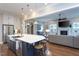 Open kitchen featuring a large kitchen island with a sink, white cabinets and stainless steel appliances at 3128 Mountain Hill Dr, Wake Forest, NC 27587