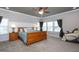 Spacious main bedroom features a tray ceiling, carpet flooring and stylish decor at 3128 Mountain Hill Dr, Wake Forest, NC 27587