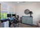 Office features a desk, computer setup, a decorative cabinet, and natural light from the window at 3128 Mountain Hill Dr, Wake Forest, NC 27587