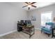 Functional office with a wooden desk, comfortable seating, neutral walls, and ample natural light at 3128 Mountain Hill Dr, Wake Forest, NC 27587
