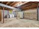 Basement area featuring a laundry area and garage doors at 3329 Broughton Dr, Durham, NC 27704