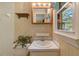 Cozy bathroom features a vanity with storage and a window for natural light at 3329 Broughton Dr, Durham, NC 27704