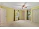 Spacious bedroom with neutral carpet, two windows, and ample closet space at 3329 Broughton Dr, Durham, NC 27704