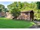 Charming brick home featuring a well-maintained lawn and mature trees at 3329 Broughton Dr, Durham, NC 27704