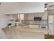 Bright kitchen featuring white cabinetry and a breakfast bar, perfect for casual dining at 3329 Broughton Dr, Durham, NC 27704