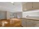 Open concept living space featuring hardwood floors and a breakfast bar that connects to the kitchen at 3329 Broughton Dr, Durham, NC 27704