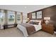 Warm bedroom featuring a queen bed, neutral walls, a window seat, and tasteful decor at 344 Church St # 49, Wendell, NC 27591