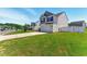 Well-maintained two-story home featuring a two-car garage and a lush green lawn at 350 Pillow Ln, Burlington, NC 27217