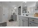 Well-lit bathroom with dual vanities and a large mirror at 351 Lowery Ln, Benson, NC 27504
