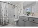 Bathroom features shower with white curtain, toilet and sink at 351 Lowery Ln, Benson, NC 27504