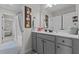 Bathroom features a single sink vanity with grey cabinetry and a framed picture of Marilyn Monroe at 351 Lowery Ln, Benson, NC 27504