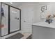 Bathroom featuring walk-in shower, linen closet and single vanity sink at 351 Lowery Ln, Benson, NC 27504