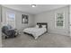 Comfortable bedroom with large windows, carpet floors and queen bed at 351 Lowery Ln, Benson, NC 27504