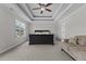 Spacious bedroom boasts tray ceiling, ceiling fan and ample natural light at 351 Lowery Ln, Benson, NC 27504