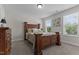 Bedroom featuring carpet floors, and a four post bed at 351 Lowery Ln, Benson, NC 27504