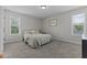 Bedroom with two windows and carpet flooring at 351 Lowery Ln, Benson, NC 27504