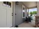 Welcoming front porch with gray siding, white trim, and seating area at 351 Lowery Ln, Benson, NC 27504