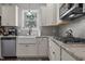Bright kitchen features white cabinets, granite counters, undermount sink, and stainless steel appliances at 351 Lowery Ln, Benson, NC 27504