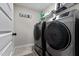 Laundry room with stainless steel washer and dryer at 351 Lowery Ln, Benson, NC 27504