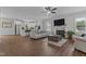 Bright, open-concept living room with hardwood floors, a fireplace, and a view into the kitchen at 351 Lowery Ln, Benson, NC 27504