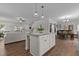 Open floor plan featuring kitchen island with granite counter, living room, and dining area at 351 Lowery Ln, Benson, NC 27504