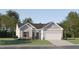 Charming single-Gathering home with stone accents, gray siding, and a well-manicured lawn at 40 Regal Gardens Ct, Angier, NC 27501