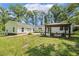Beautiful backyard with gazebo, outdoor seating, and lush green lawn at 418 S West St, Cary, NC 27511