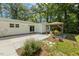 A view of the concrete patio, landscaping, and the backyard gazebo at 418 S West St, Cary, NC 27511