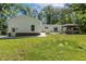 Expansive backyard featuring a well-maintained lawn and access to the detached garage at 418 S West St, Cary, NC 27511