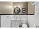Compact bathroom featuring a classic white sink, toilet, and modern lighting at 418 S West St, Cary, NC 27511