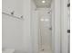 Bathroom featuring a white shower with a shower curtain, white walls, and a hook for towels at 418 S West St, Cary, NC 27511