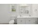 Bright bathroom with dual sinks and corner shower at 418 S West St, Cary, NC 27511