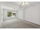 Spacious bedroom showcasing neutral carpet, fresh white walls, and sun-filled windows at 418 S West St, Cary, NC 27511
