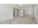 Spacious bedroom features neutral carpet, three closets, and French doors at 418 S West St, Cary, NC 27511