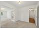 Spacious room featuring a door to a bedroom, French doors to an office and hardwood floors at 418 S West St, Cary, NC 27511