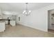 Open floor plan features dining area with tile flooring and modern lighting at 418 S West St, Cary, NC 27511