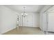 Dining area featuring a chandelier, tile flooring and access to outdoors at 418 S West St, Cary, NC 27511