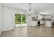 Bright dining area with tile flooring and sliding doors open to the backyard at 418 S West St, Cary, NC 27511