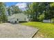 View of the three-car garage and expansive backyard of this property at 418 S West St, Cary, NC 27511