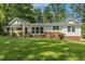 Charming single-story home with brick accents and a well-manicured lawn at 418 S West St, Cary, NC 27511