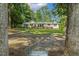 Charming single-story home with brick accents surrounded by lush trees at 418 S West St, Cary, NC 27511