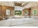 Spacious unfinished garage features a high ceiling and a door opening to a gazebo in the backyard at 418 S West St, Cary, NC 27511