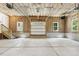 Spacious unfinished garage with natural lighting from windows and an automatic door at 418 S West St, Cary, NC 27511